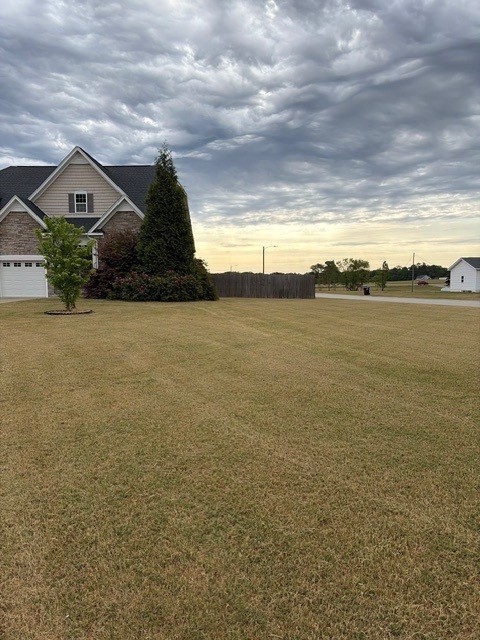 Mulch and drainage work completed by KEEN